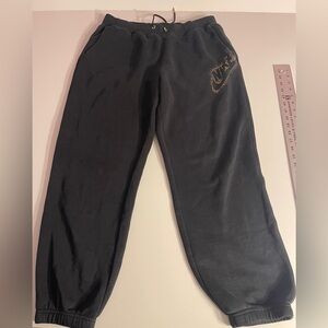 Nike Women’s Sportswear Club Fleece Pants/Joggers with glittering gold on logo